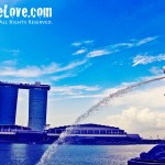 The Singapore merlion with a view of Marina Bay Sands in the background, Singapore, Singapore